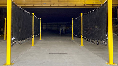 Fall protection netting system for use with flatbed trailer.